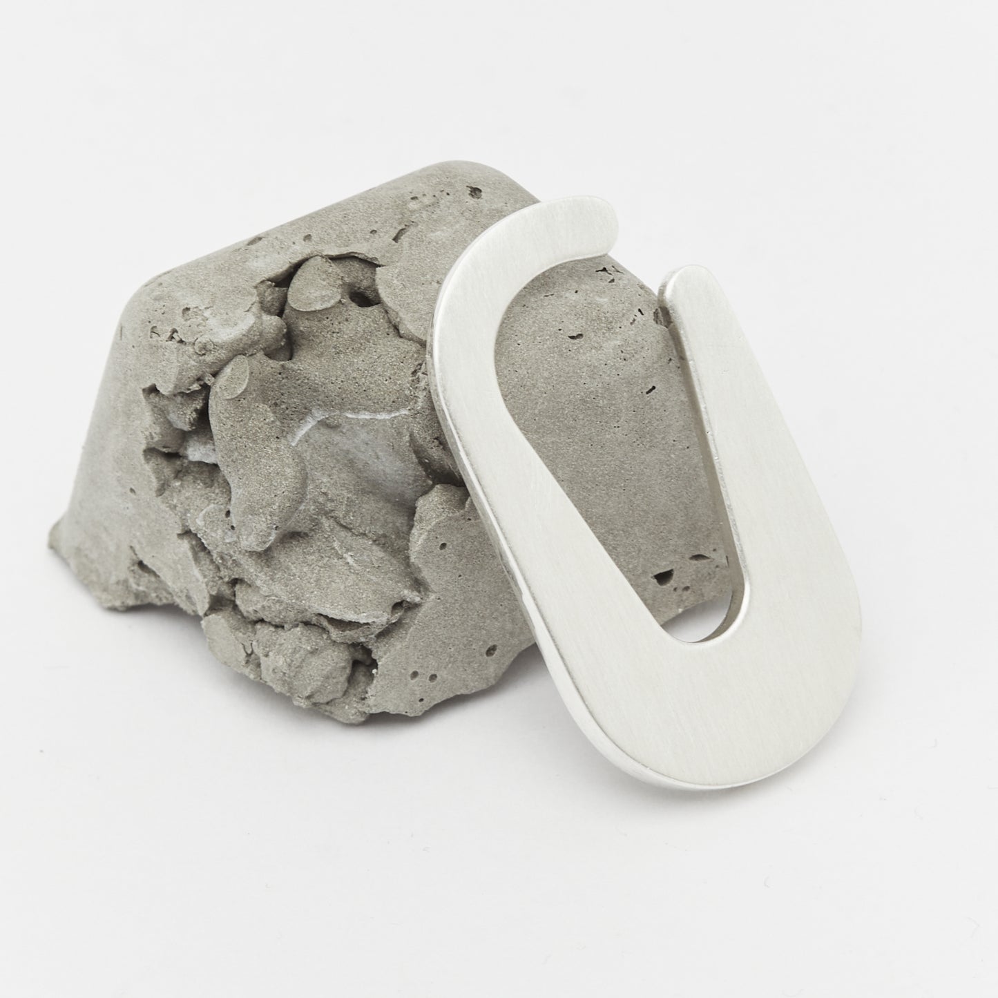 Minimalist sculptural earcuff quiet design silver rock jewelry - Unique handcrafted silver ear cuff – statement jewellery by AROE.
